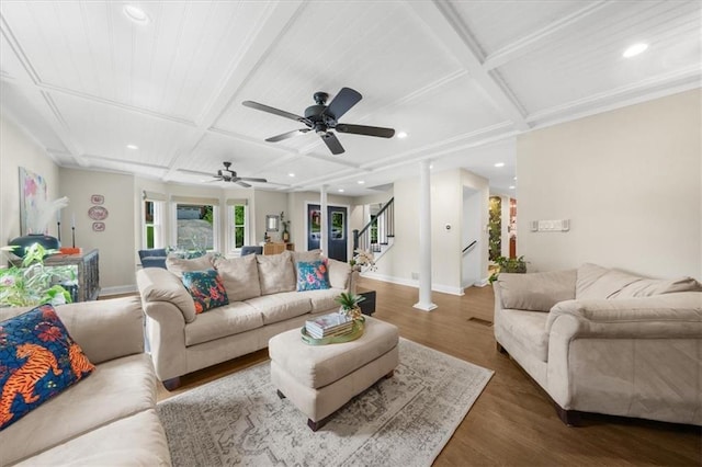 living room with dark hardwood / wood-style floors, coffered ceiling, and beam ceiling