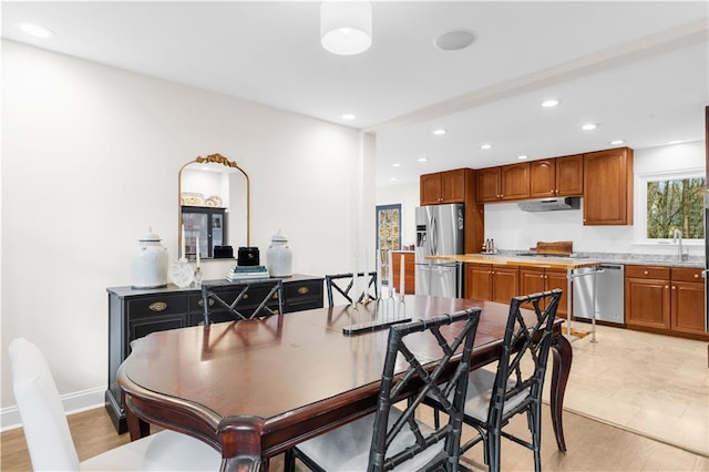 dining room featuring sink