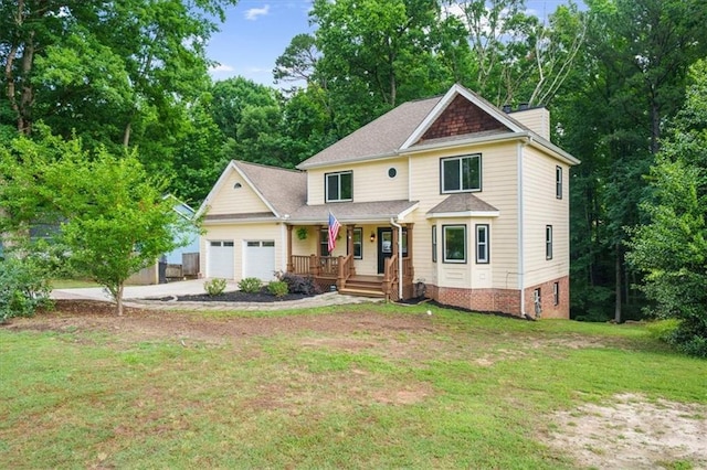 view of front of property featuring a garage, covered porch, and a front lawn