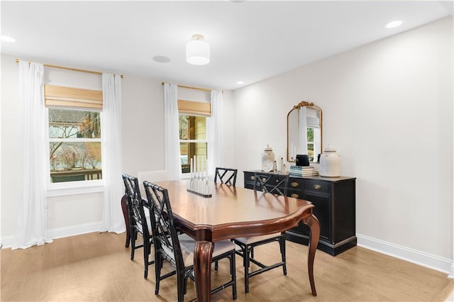 dining area with light hardwood / wood-style flooring