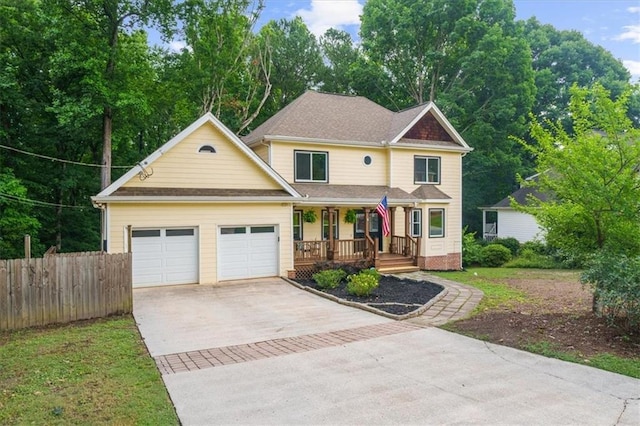 view of front facade with a garage and covered porch