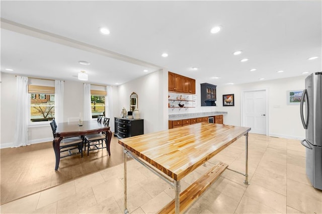 dining area featuring light tile patterned flooring