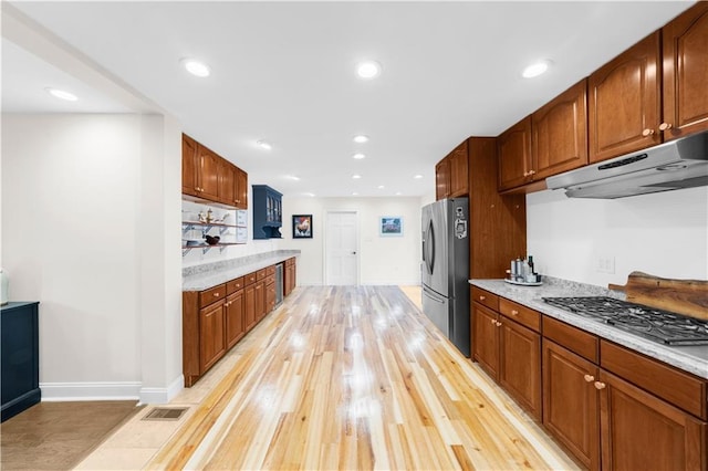 kitchen with stainless steel appliances and light wood-type flooring