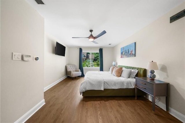 bedroom featuring hardwood / wood-style flooring and ceiling fan