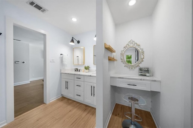 bathroom featuring vanity and wood-type flooring