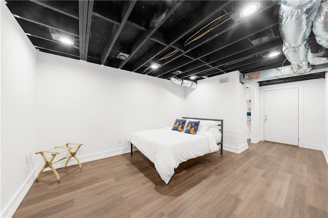 bedroom featuring wood-type flooring