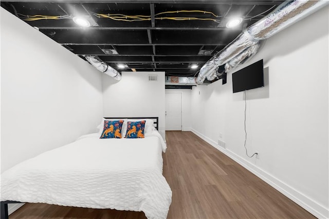 bedroom featuring hardwood / wood-style flooring