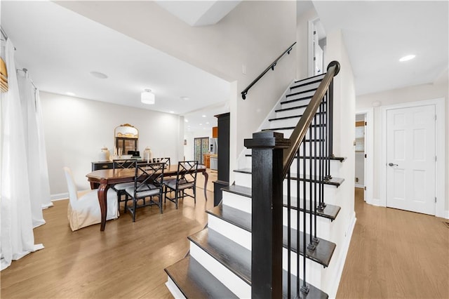 staircase featuring hardwood / wood-style flooring