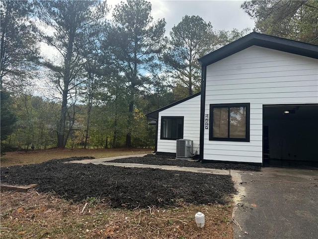 view of home's exterior with cooling unit