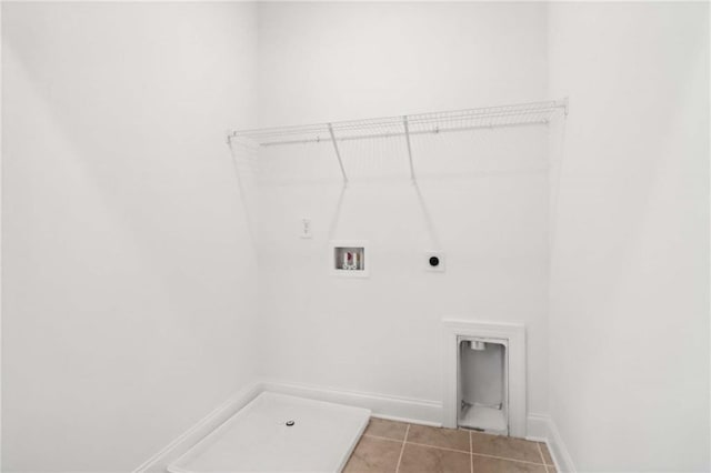 clothes washing area featuring tile patterned flooring, electric dryer hookup, and hookup for a washing machine