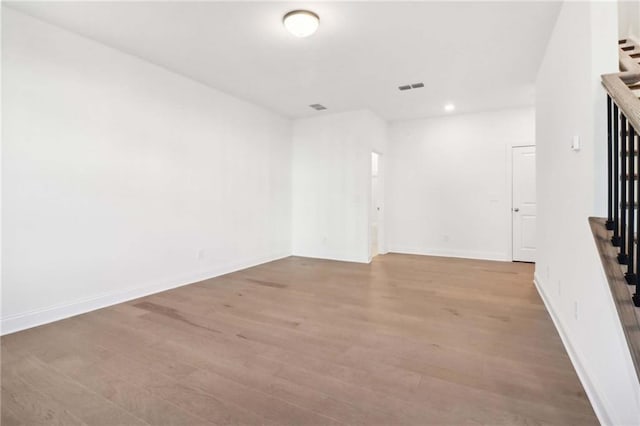 spare room featuring light wood-type flooring