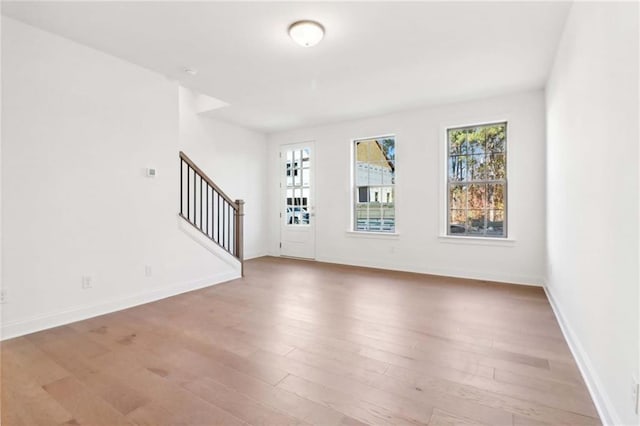 unfurnished living room featuring hardwood / wood-style floors