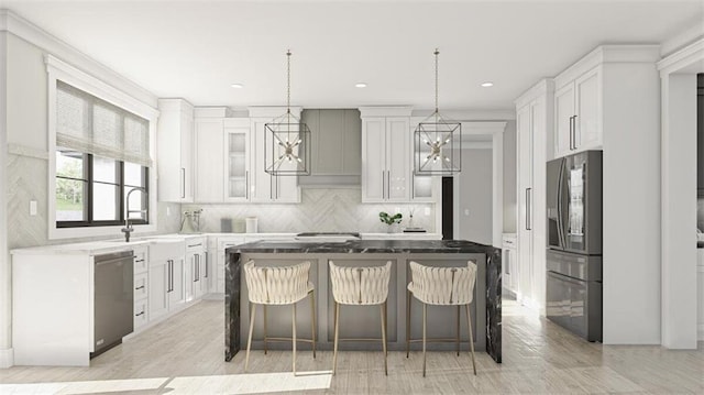 kitchen featuring appliances with stainless steel finishes, a kitchen breakfast bar, white cabinets, and a kitchen island