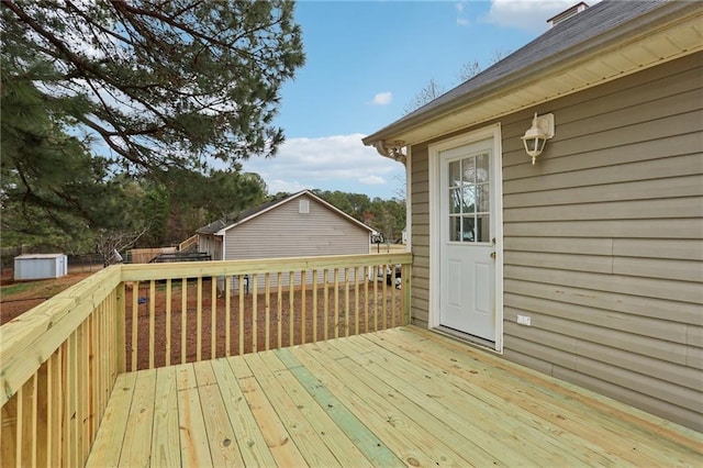 wooden deck with an outdoor structure