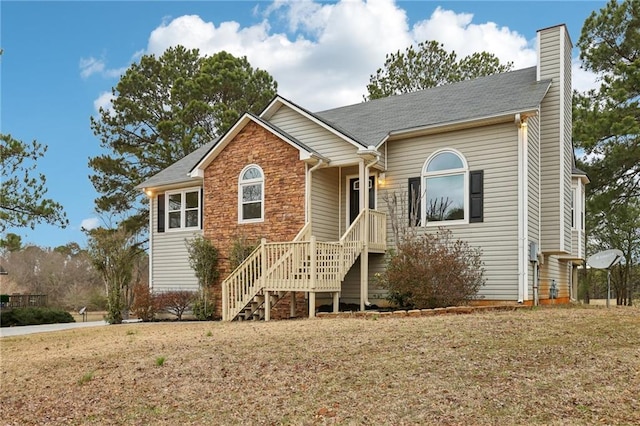 single story home with a front yard and a chimney