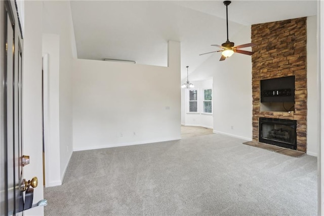 unfurnished living room with baseboards, carpet, a stone fireplace, high vaulted ceiling, and a ceiling fan