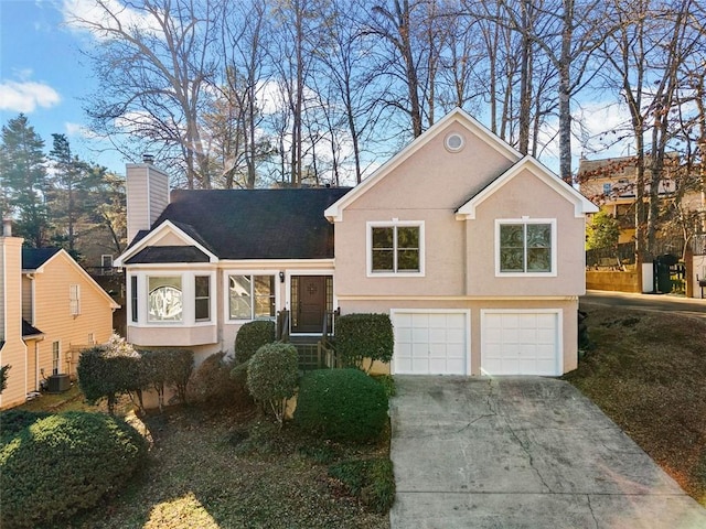 view of front facade with central AC and a garage