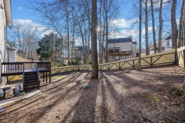 view of yard featuring a wooden deck