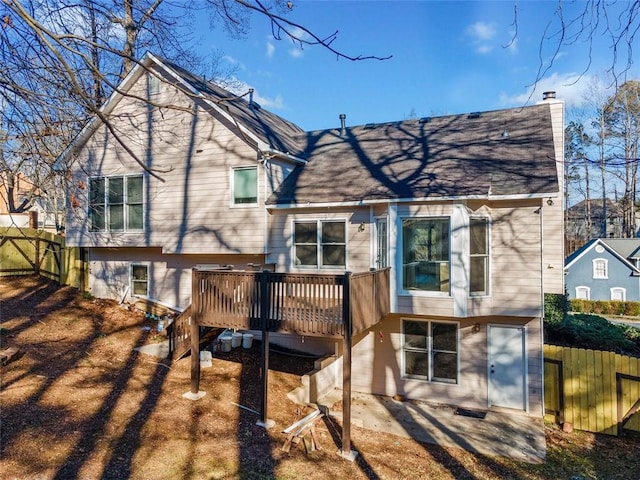 back of house featuring a deck