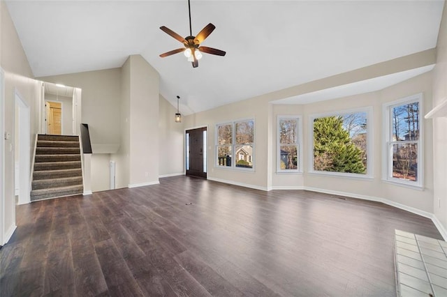 unfurnished living room with ceiling fan, dark hardwood / wood-style floors, and a wealth of natural light