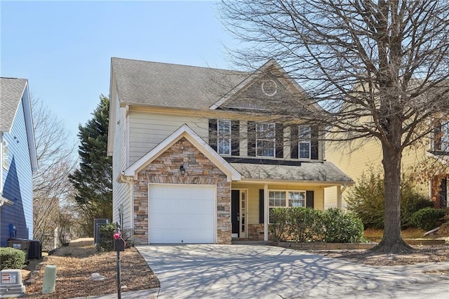 view of front facade featuring driveway, a garage, stone siding, roof with shingles, and central air condition unit