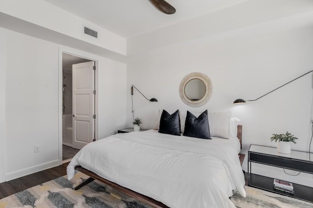 bedroom featuring ceiling fan and dark hardwood / wood-style flooring