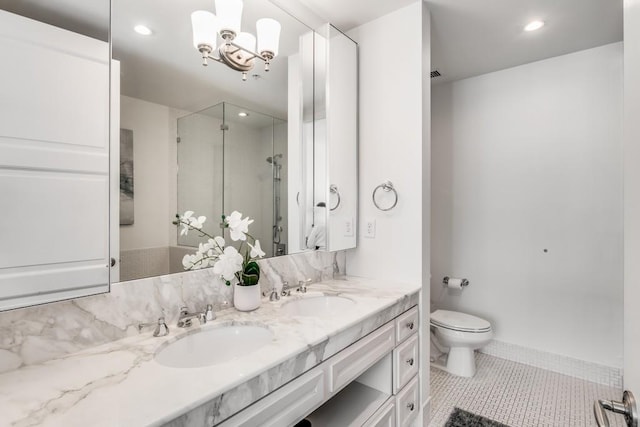 bathroom featuring toilet, vanity, tile patterned flooring, a notable chandelier, and an enclosed shower