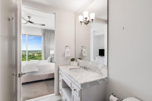 bathroom with ceiling fan and vanity