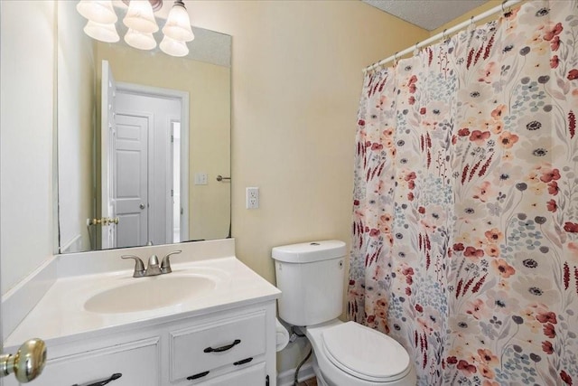 full bathroom with toilet, vanity, and a shower with curtain