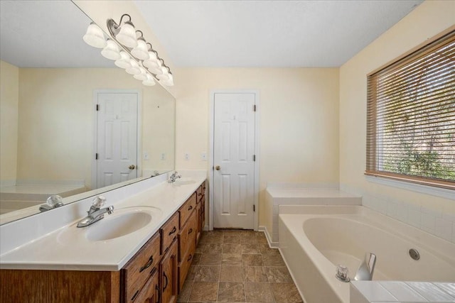 full bath with double vanity, a bath, and a sink