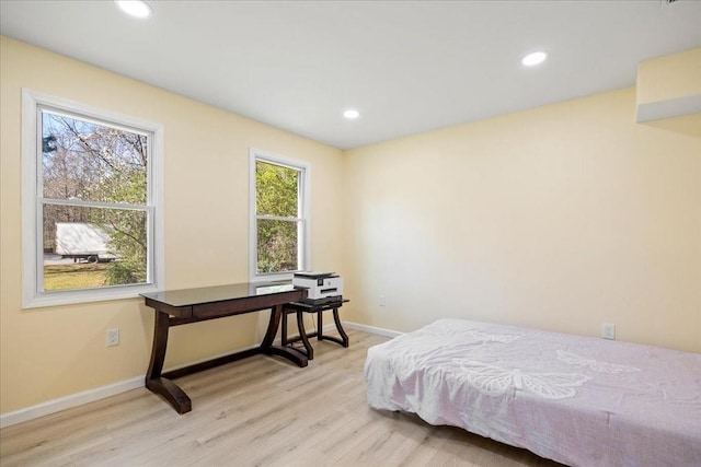 bedroom with recessed lighting, baseboards, and wood finished floors