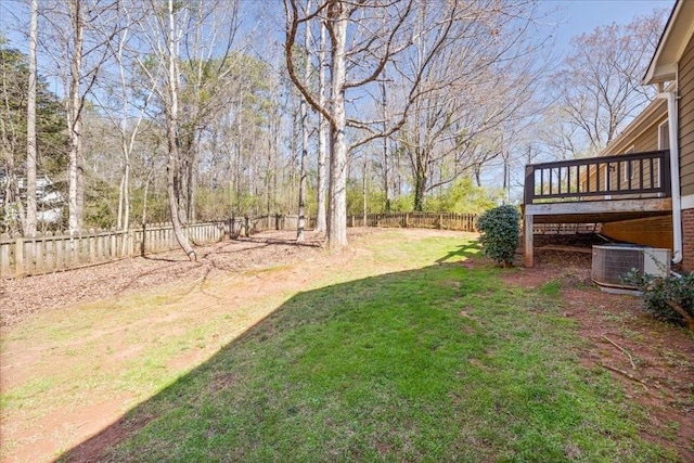 view of yard featuring cooling unit, a fenced backyard, and a wooden deck