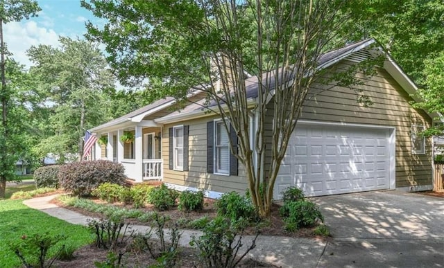 view of side of home with a garage