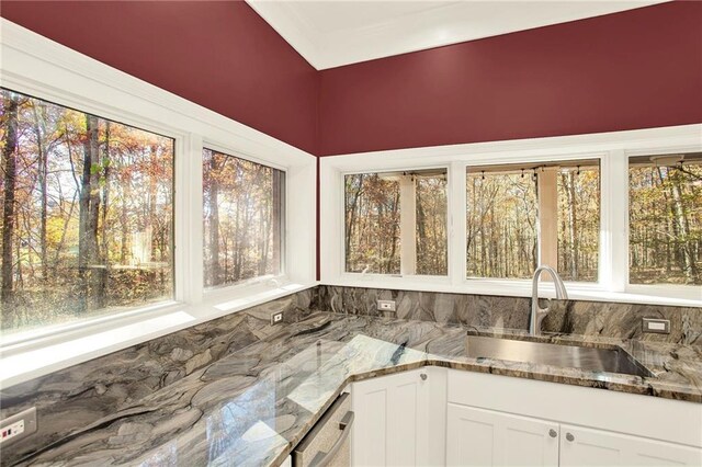 unfurnished sunroom with sink