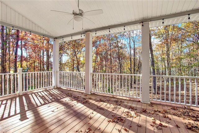 wooden terrace featuring ceiling fan