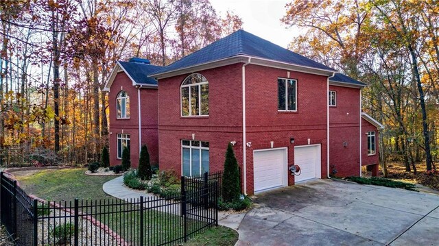 view of property exterior featuring a yard and a garage