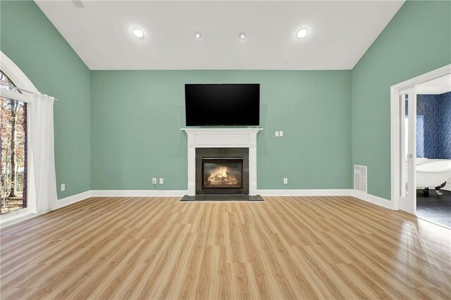 unfurnished living room with light hardwood / wood-style floors