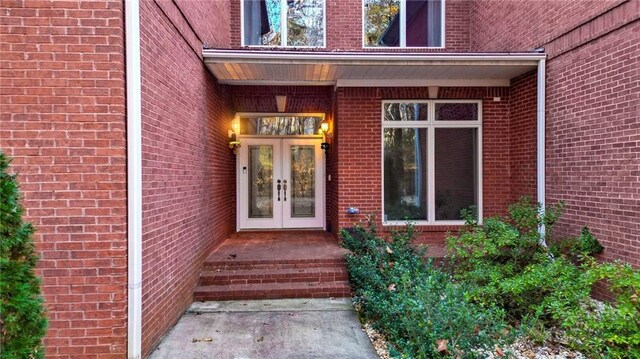 view of exterior entry featuring french doors