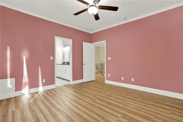 unfurnished bedroom with ensuite bath, ceiling fan, crown molding, and light hardwood / wood-style flooring