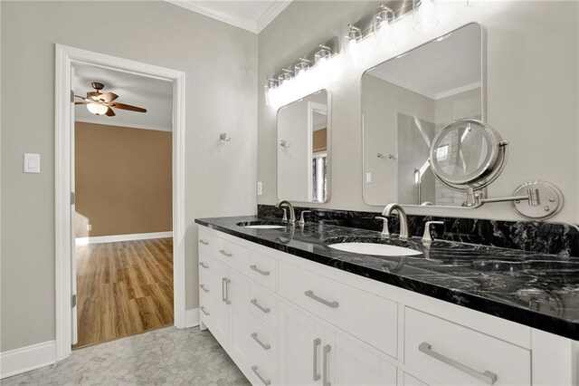 bathroom with ceiling fan, crown molding, vanity, and hardwood / wood-style floors