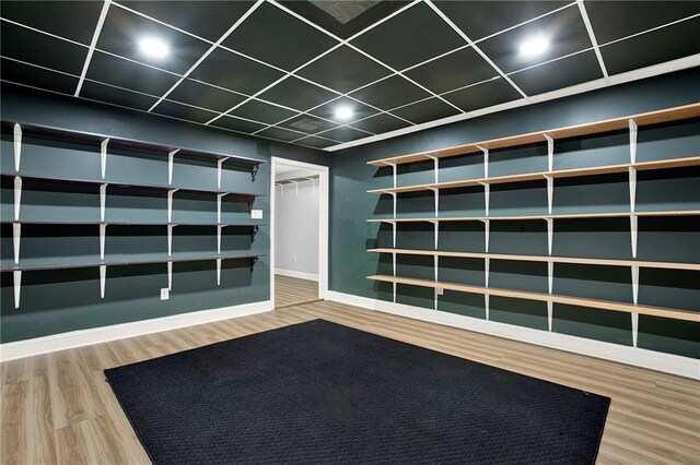 mudroom with wood-type flooring