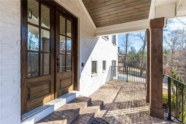 entrance to property with brick siding