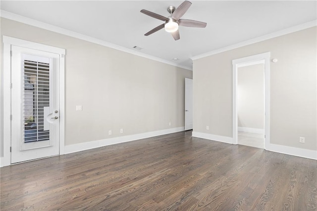 unfurnished room featuring ornamental molding, a ceiling fan, baseboards, and wood finished floors