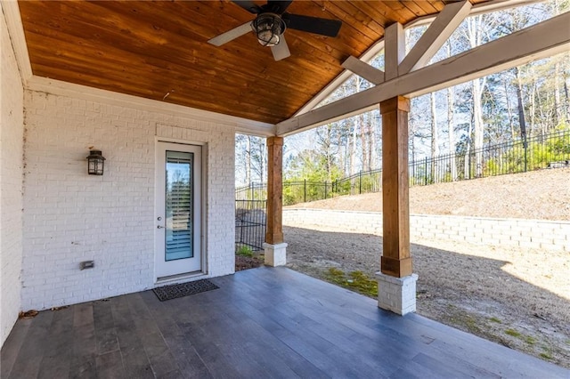 view of patio with a ceiling fan and fence