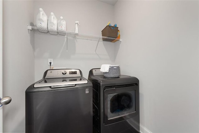 laundry room featuring washing machine and clothes dryer