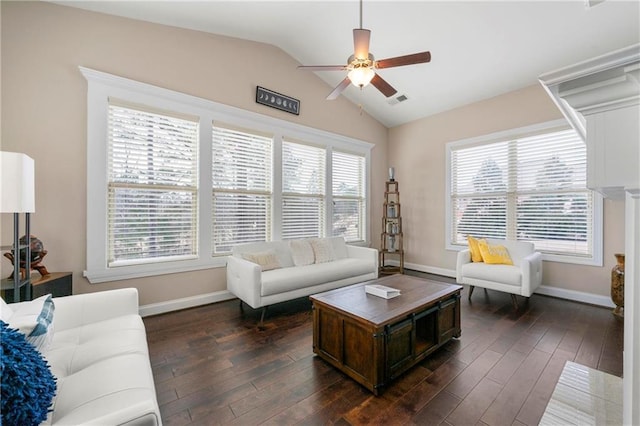 living room featuring dark hardwood / wood-style flooring, vaulted ceiling, and ceiling fan