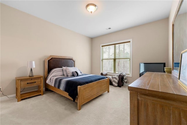 bedroom with light carpet