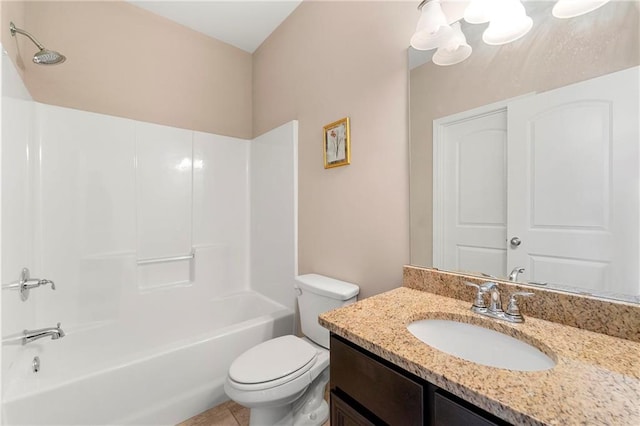 full bathroom with vanity, washtub / shower combination, and toilet