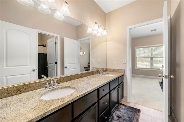 bathroom featuring tile patterned flooring and vanity