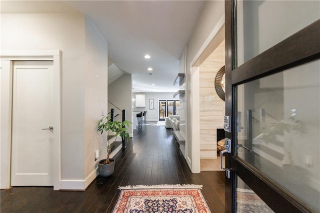 corridor featuring dark hardwood / wood-style flooring